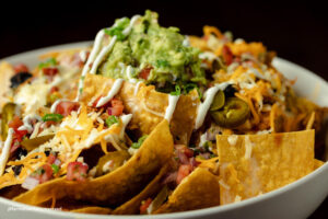 plate of nachos on corn chips