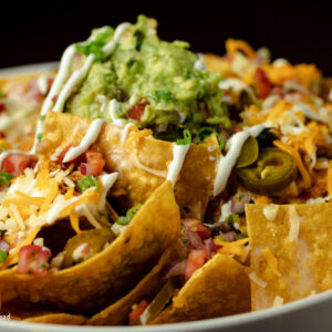 plate of nachos on corn chips