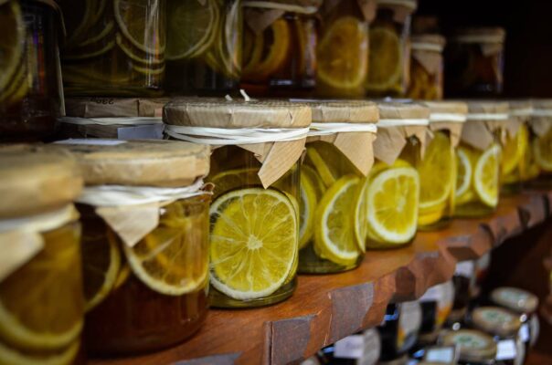 jars of lemons and limes on a pantry shelf