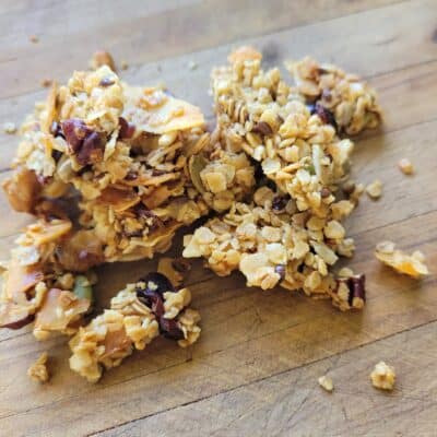 clusters of homemade granola on a wooden chopping board