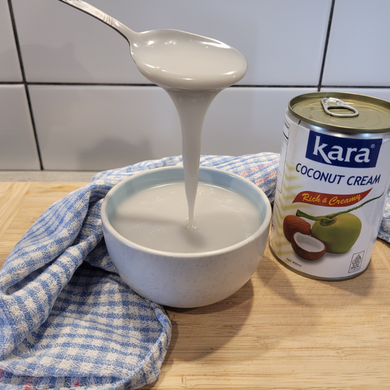 dairy-free sweetened condensed milk in a small blue bowl