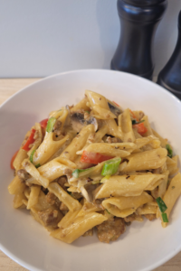 a bowl of "Creamy Pork & Mushroom Pasta: Perfect Weeknight Dinner