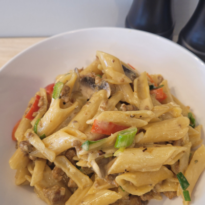 a bowl of "Creamy Pork & Mushroom Pasta: Perfect Weeknight Dinner