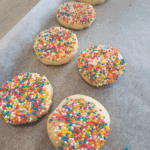 biscuits ready to be baked, they are topped with sprinkles