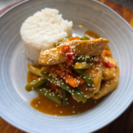 slow cooker honey and garlic chicken with a side of rice with steam veggies