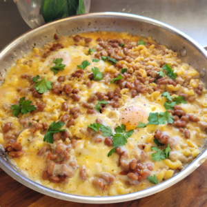 boxed mac and cheese breakfast with poached eggs on the top