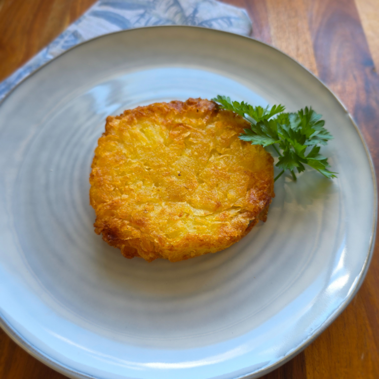 crispy hash brown on a blue plate