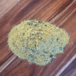 dried chicken bouillon powder on a wooden board