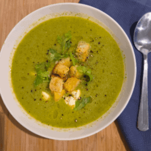 a bowl of broccoli pea and creamy ricotta soup
