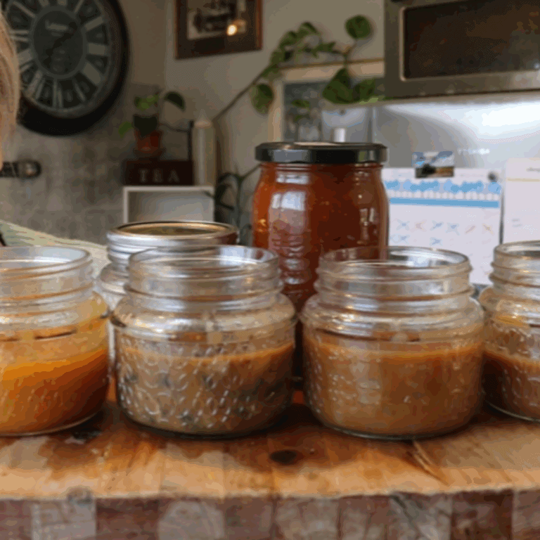 jars of gravies and sauces on a wooden board