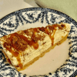 Close-up of sliced Crunchie cheesecake showing crushed honeycomb pieces and buttery biscuit base.