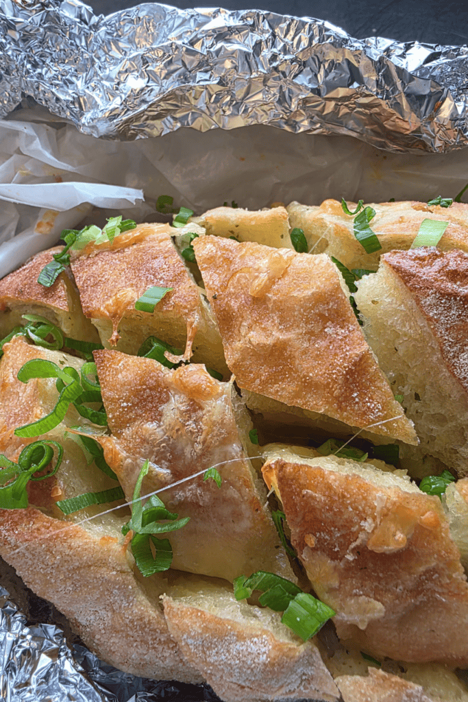 “Pull-apart cheesy garlic bread fresh from the oven.”