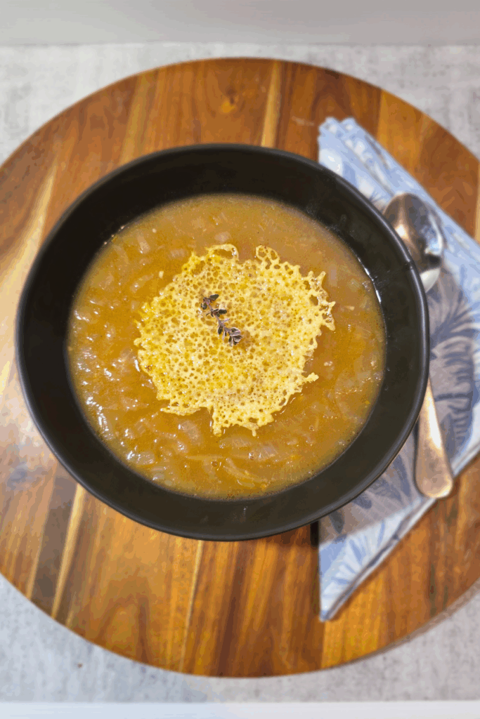 A rich bowl of French Onion Soup with Cheese Crisp 
