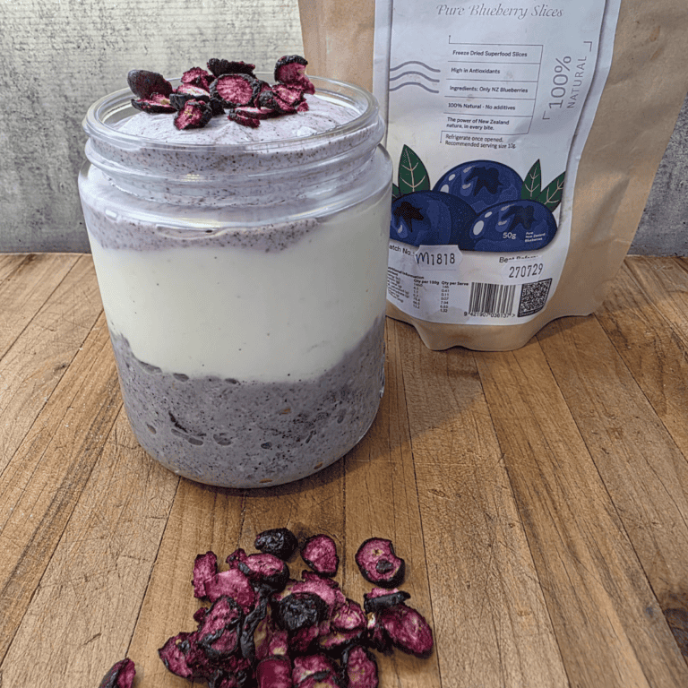 A lovely, vibrant jar of layered overnight blueberry oats
