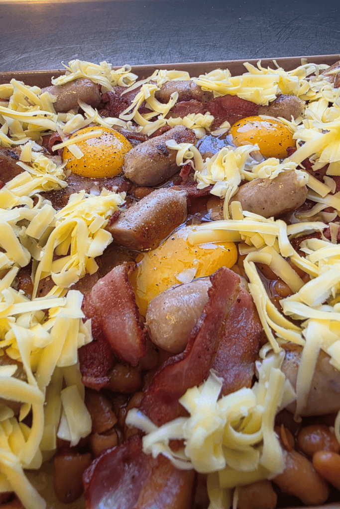 make ahead full breakfast uncooked before going into the oven. Hash browns, bacon, eggs, baked beans and sausages