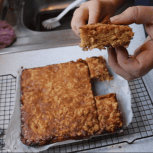 oaty caramel slice on a wire rack