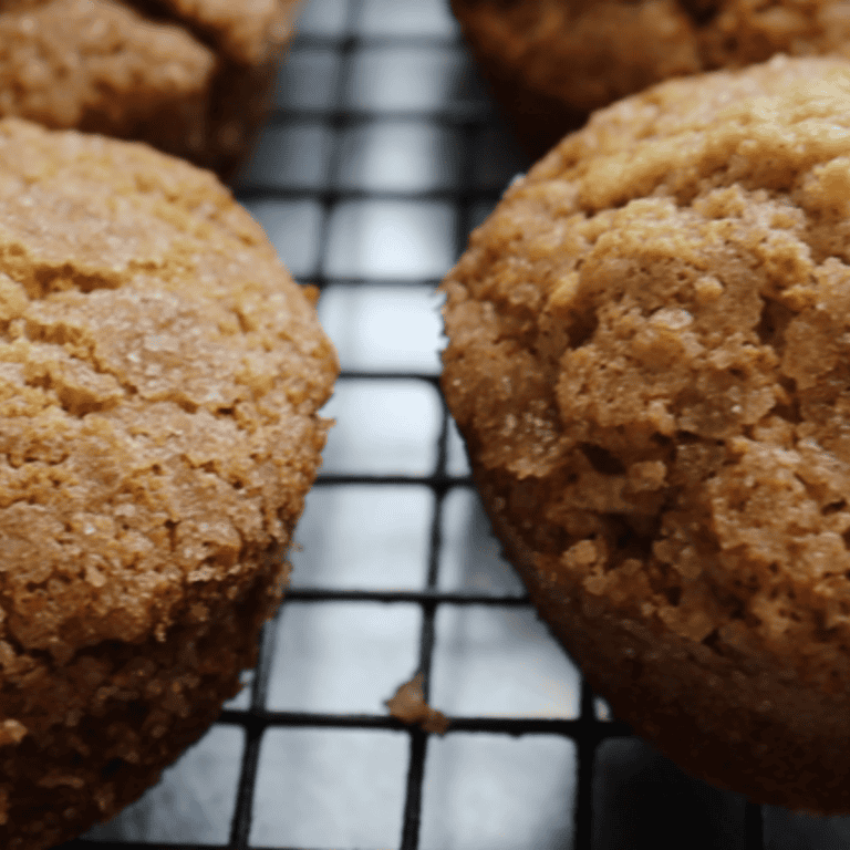 Close-up of freshly baked donut muffins cooling before being coated in cinnamon sugar