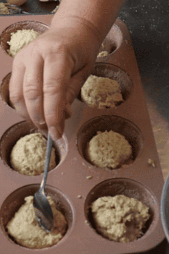 Close-up of homemade donut muffin batter in a mixing bowl before baking