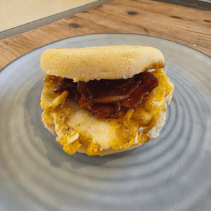 Homemade bacon and egg McMuffin breakfast sandwich