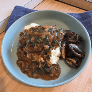 Homemade beef olives plated with creamy mash & rich gravy