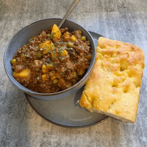Homemade savoury mince with vegetables and potatoes in rich gravy