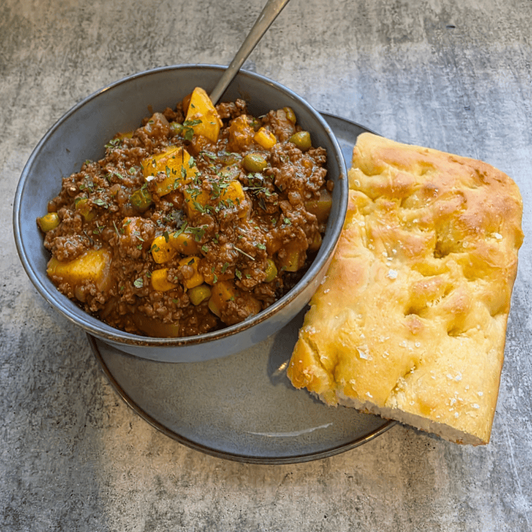 Homemade savoury mince with vegetables and potatoes in rich gravy