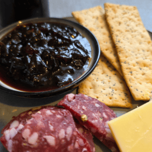 Balsamic onion jam served with cheese and crackers