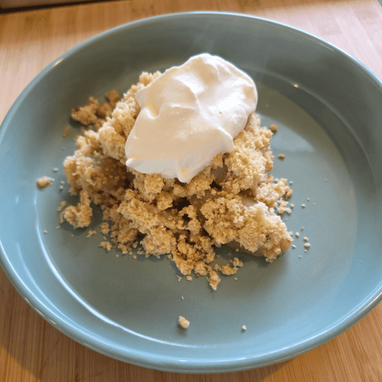Homemade apple & pear crumble served warm with cream