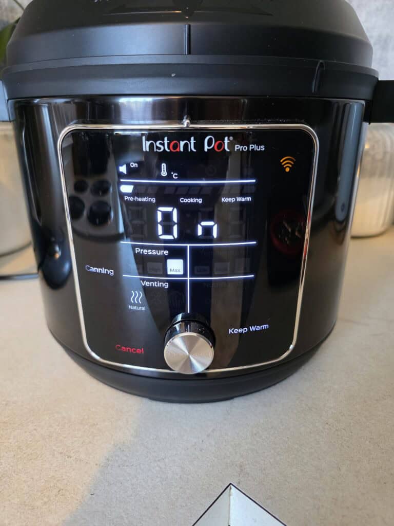 A instant pot pro plus sitting on a kitchen bench ready to do some canning