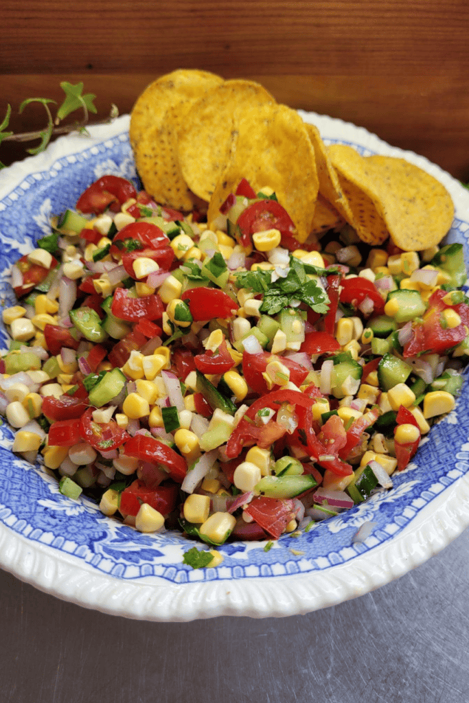 Sweet corn salsa with tomato, cucumber, and coriander