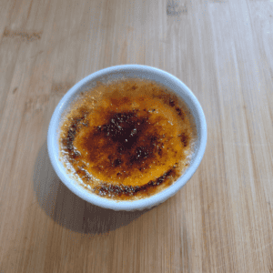 Homemade vanilla crème brûlée in ramekins