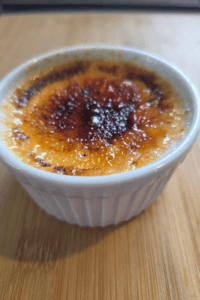 Homemade vanilla crème brûlée in ramekins