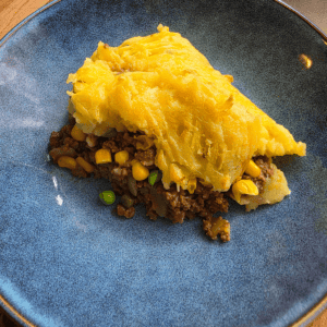 Homemade beef cottage pie with savoury mince, vegetables and cheesy mashed potato