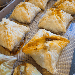Homemade mini mince and cheese pies baked until golden in flaky puff pastry