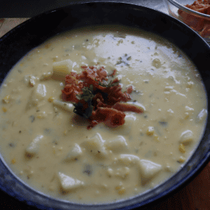 Creamy sweet corn and potato chowder topped with crispy bacon