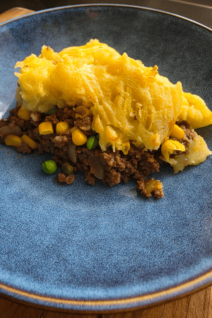 Homemade beef cottage pie with savoury mince, vegetables and cheesy mashed potato